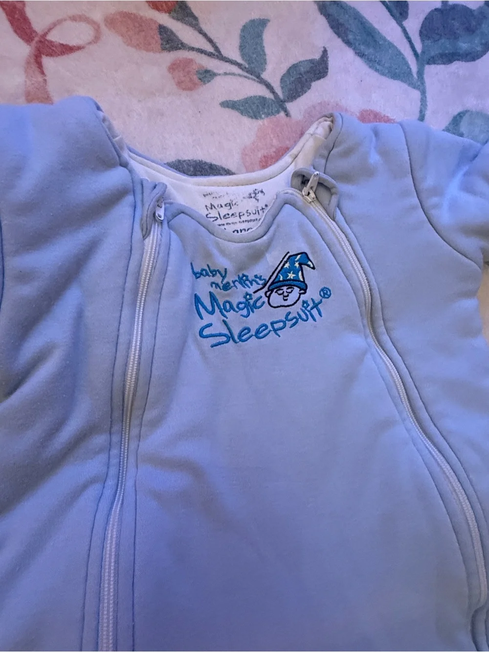 Two baby Merlin magic sleep suits- Cream and Light Blue
